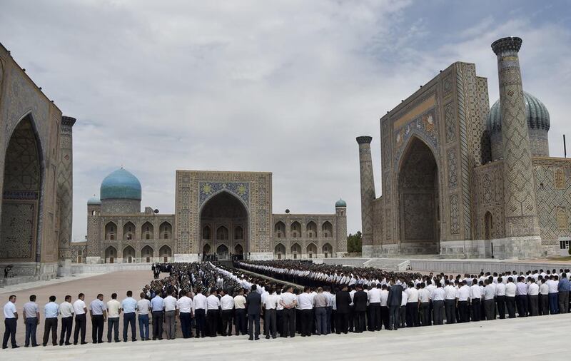 People gather to pay their last respect during the funeral of President Islam Karimov at the historic Registan Square in Samarkand, Uzbekistan, early Saturday, September 3, 2016. (AP Photo)