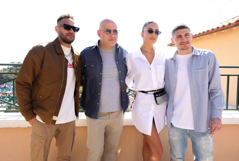 Paris Saint-Germain's Neymar, left, teammate Marco Verratti, right, and his wife Jessica Aidi Verratti in Monaco. AFP