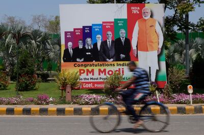 A billboard promoting the popularity of Indian Prime Minister Narendra Modi in New Delhi. AP