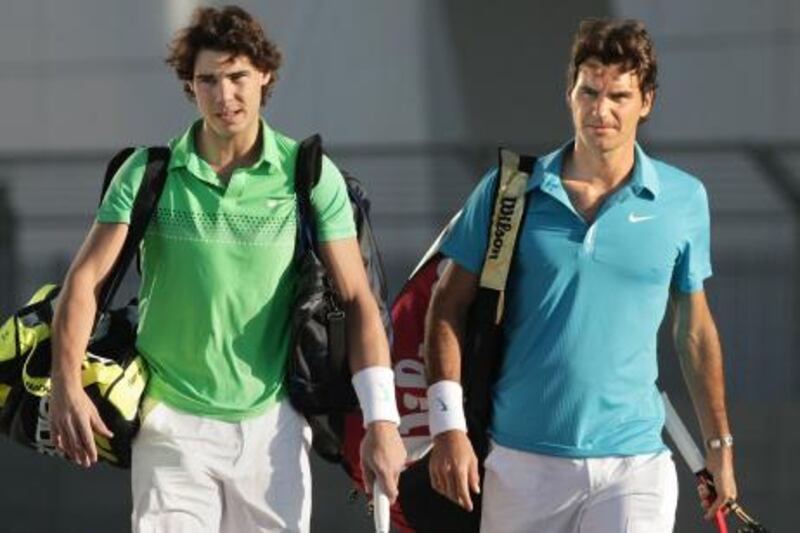 United Arab Emirates - Abu Dhabi - Dec 31 - 2009 : Roger Federer (right) and Rafael Nadal arives to play tennis on the F1 track on Yas Island Hotel.  ( Jaime Puebla / The National ) *** Local Caption ***  JP Capitala 03.jpg