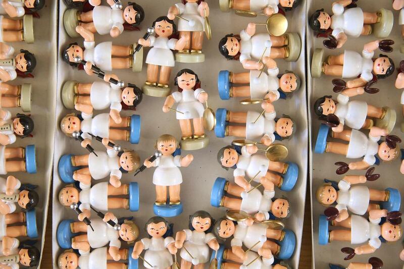 Hand-crafted wooden figurines of musical angels lie in a box after their assembly at the Frieder and Andre Uhlig Kunstgwerbe atelier. Sean Gallup / Getty Images