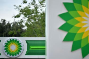 BP logos at a petrol station in London. The company swung to a full-year loss of $5.7bn, as the coronavirus pandemic ravaged global energy demand. AFP
