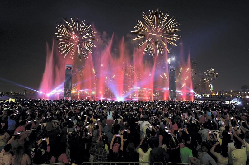 Dubai, Decemeber, 02 2019: People enjoy the fireworks at the Dubai Festival City in Dubai . Satish Kumar/ For the National