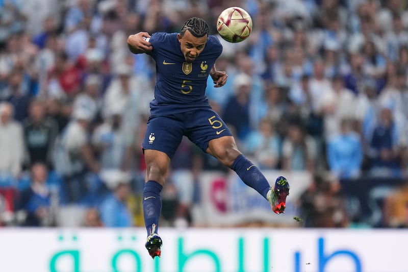 France's Jules Kounde heads the ball. AP