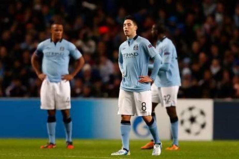 Samir Nasri, centre, has been criticised for his performances in the past by his Manchester City manager, but Roberto Mancini says he believes the French midfielder is 'one of the best players in England.' AP Photo