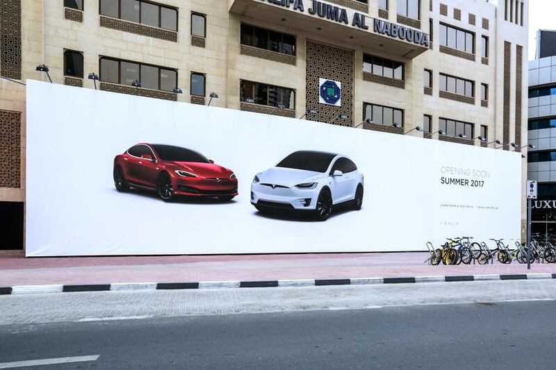 A Tesla billboard on Sheikh Zayed Road beside Burj Khalifa Metro Station. Victor Besa for The National