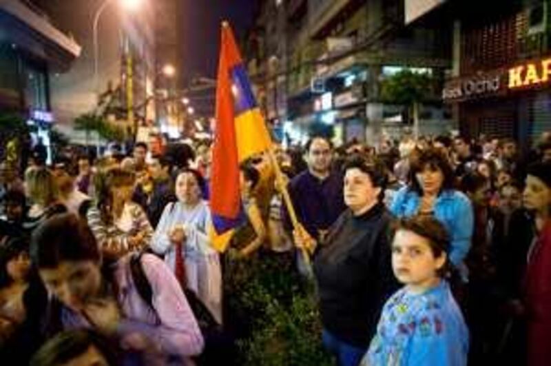 ****FOR MOOD ON THE STREET PIECE OUT OF BEIRUT BY RYM GHAZEL
5/9/2009 Beirut, Lebanon
A Lebanese Armenian woman holds a Armenian flag at a Tashnak party rally in the Bourj Hamoud district of Beirut.

Lebanon's Christian Armenian minority, the majority of which came to Lebanon while fleeing the Turkish Genocide at the beginning of the 20th Century, have occupied an unique role in Lebanese politics since the beginning of the Lebanese Civil War in 1975. After declaring neutrality during the internecine fighting that marked the bloody 1975-1990 conflict, and being marginalized in parliament by the dominant political forces of Hariri during the Syrian occupation, the Armenians now find themselves in a unique position of power in Lebanon's upcoming elections. With the Hezbollah-led Opposition and Hariri-led Majority vying for the upper hand, the Christian seats in Lebanon's confessional parliamentary system are where much of the uncertainty lies—and the Armenians, who still remember Rafiq al-Hariri's marginalization of them during the 2000 and 2005 elections, could play a distinct and deciding role in shaping Lebanon's political future.

Credit: Bryan Denton for The National