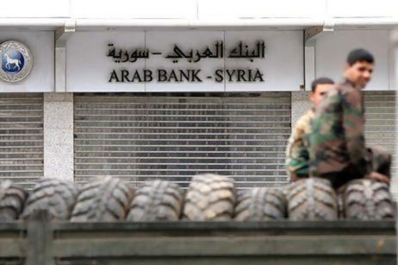 Banking transactions such as trade finance or corporate lending have taken a big hit since the start of the crisis in Syria. Louai Beshara / AFP