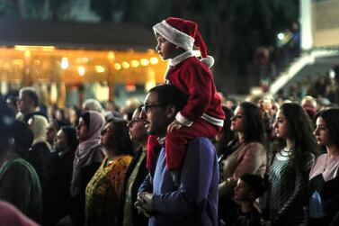 Palestinians attend a Christmas tree lighting celebration on Tuesday, December 3, 2019 in Gaza City. Photo: Mahmud Hams/ AFP 