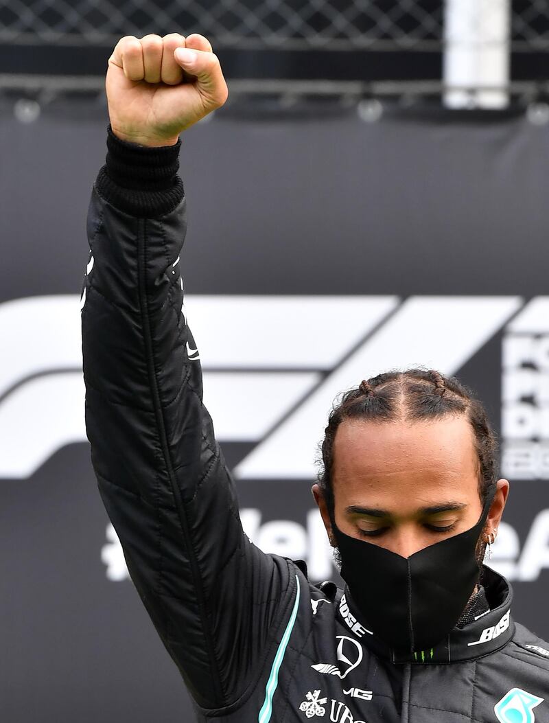 Lewis Hamilton on the podium after the  Styrian Grand Prix. AFP