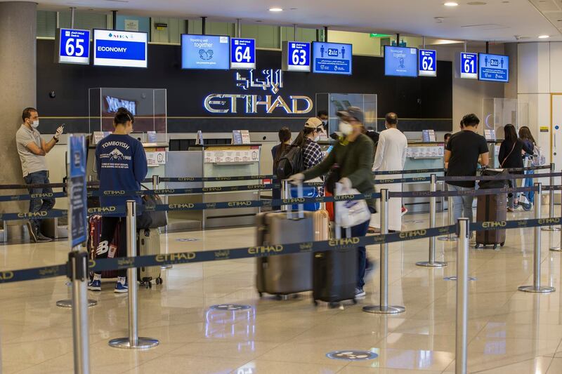 Stickers on the floor encouraging passengers to remain 2 metres apart  while queueing. Courtesy of Etihad Airways.