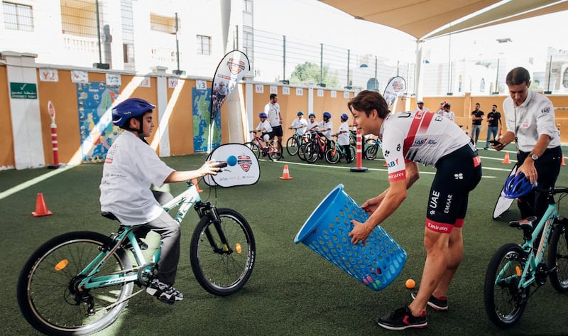UAE Team Emirates cyclists deliver coaching clinics to children at Al Rebeeh School.