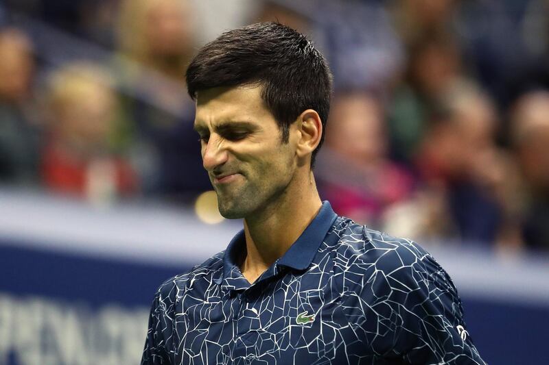 NEW YORK, NY - SEPTEMBER 09: Novak Djokovic of Serbia reacts during his men's Singles finals match against Juan Martin del Potro of Argentina on Day Fourteen of the 2018 US Open at the USTA Billie Jean King National Tennis Center on September 9, 2018 in the Flushing neighborhood of the Queens borough of New York City.   Al Bello/Getty Images/AFP
== FOR NEWSPAPERS, INTERNET, TELCOS & TELEVISION USE ONLY ==
