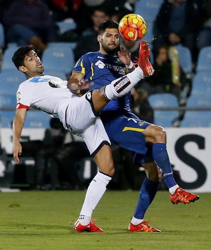 Getafe midfielder Angel Lafita, right, duels for the ball with Deportivo La Coruna defender Juanfran Moreno during the Spanish Primera Division match at Coliseum Alfonso Perez stadium in Getafe, near Madrid, Spain, 30 December 2015. JuanJo Martin / EPA 