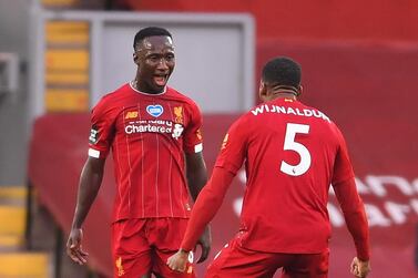 Soccer Football - Premier League - Liverpool v Chelsea - Anfield, Liverpool, Britain - July 22, 2020 Liverpool's Naby Keita celebrates scoring their first goal with Georginio Wijnaldum, as play resumes behind closed doors following the outbreak of the coronavirus disease (COVID-19) Pool via REUTERS/Laurence Griffiths EDITORIAL USE ONLY. No use with unauthorized audio, video, data, fixture lists, club/league logos or 'live' services. Online in-match use limited to 75 images, no video emulation. No use in betting, games or single club/league/player publications. Please contact your account representative for further details.