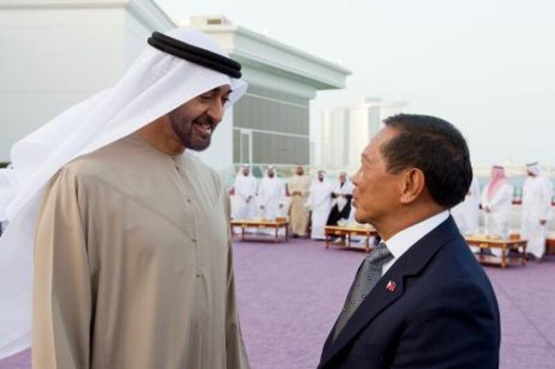 ABU DHABI, UNITED ARAB EMIRATES - January 14, 2013: HH General Sheikh Mohamed bin Zayed Al Nahyan Crown Prince of Abu Dhabi Deputy Supreme Commander of the UAE Armed Forces (L), meets with HE Jejomar Binay Vice President of the Philippines (R), during a Sea Palace majilis gathering..( Ryan Carter / Crown Prince Court - Abu Dhabi ).---