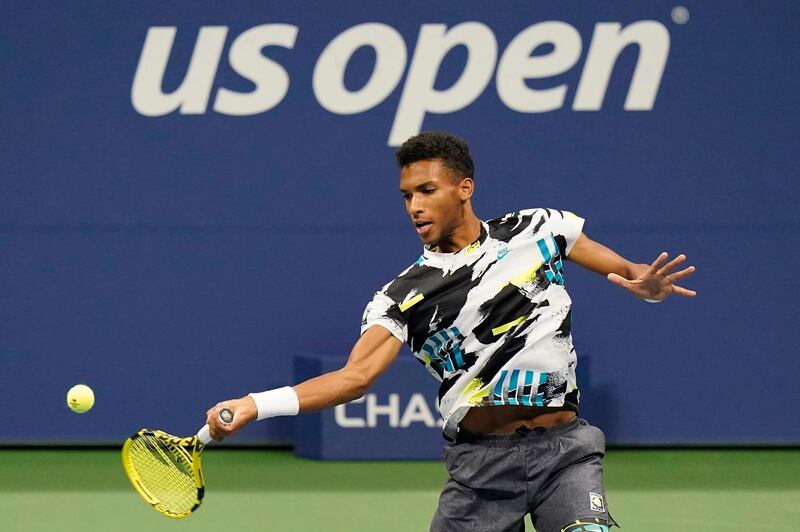 Felix Auger-Aliassime returns a shot to Andy Murray during the second round of the US Open. PA