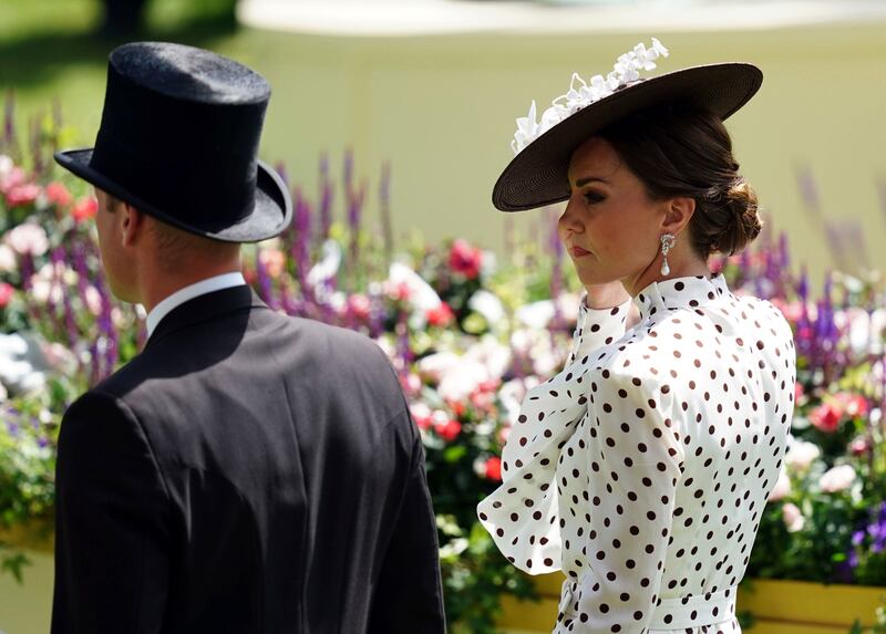 Meanwhile, Prince William wore a traditional top hat and tails. AP