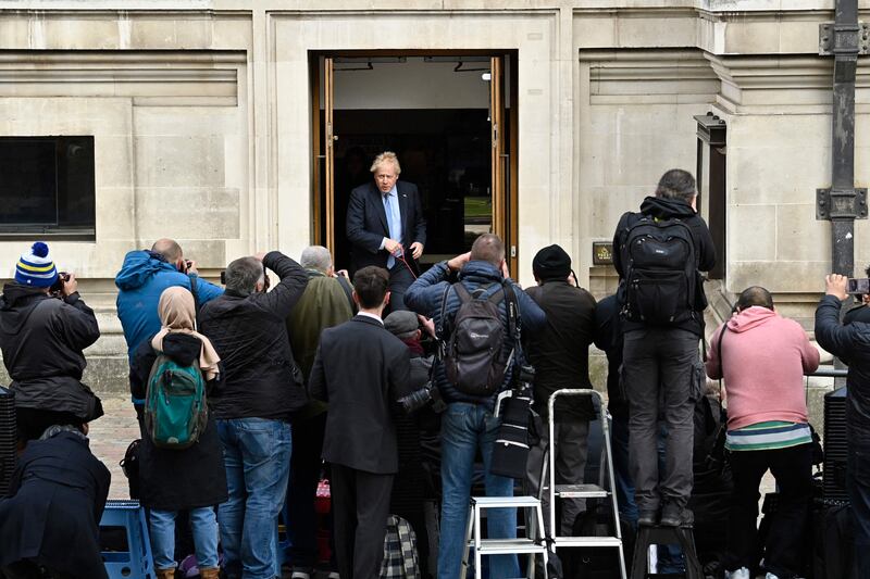 Photographers surround Boris Johnson as he steps out of the Methodist Hall in central London after casting his vote. AFP