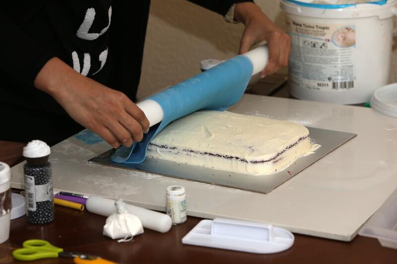 Sahar Latheef making a T - Shirt birthday cake at her villa in Jumeirah in Dubai. Pawan Singh / The National