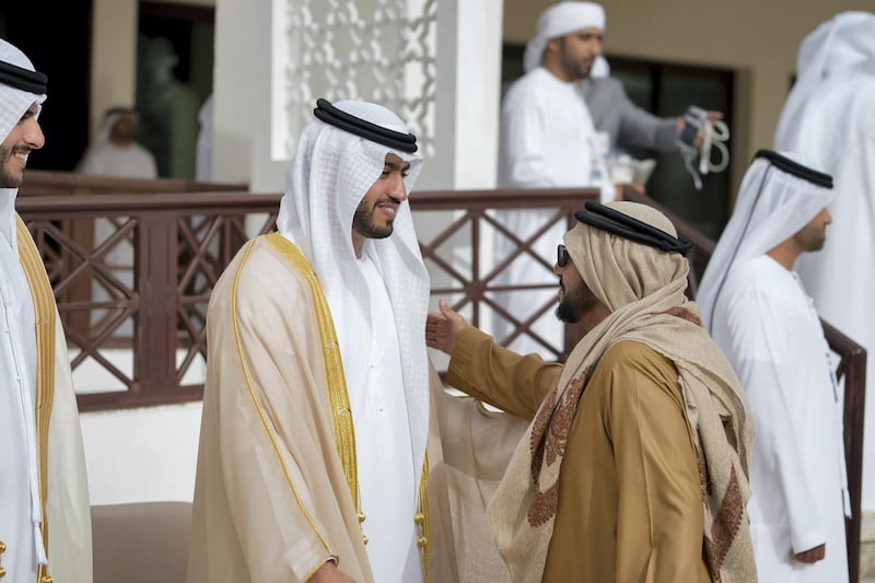 ABU DHABI, UNITED ARAB EMIRATES - January 21, 2018: A groom greets a guest during a mass wedding reception for HH Sheikh Mubarak bin Hamdan bin Mubarak Al Nahyan (not shown), HH Sheikh Mohamed bin Ahmed bin Hamdan Al Nahyan (not shown) and other grooms, at Majlis Al Bateen.

( Mohamed Al Hammadi / Crown Prince Court - Abu Dhabi )
---