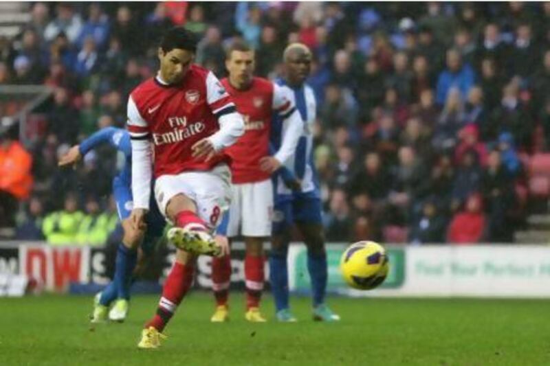 Arsenal's Mikel Arteta scores from the penalty spot. Clive Brunskill / Getty Images