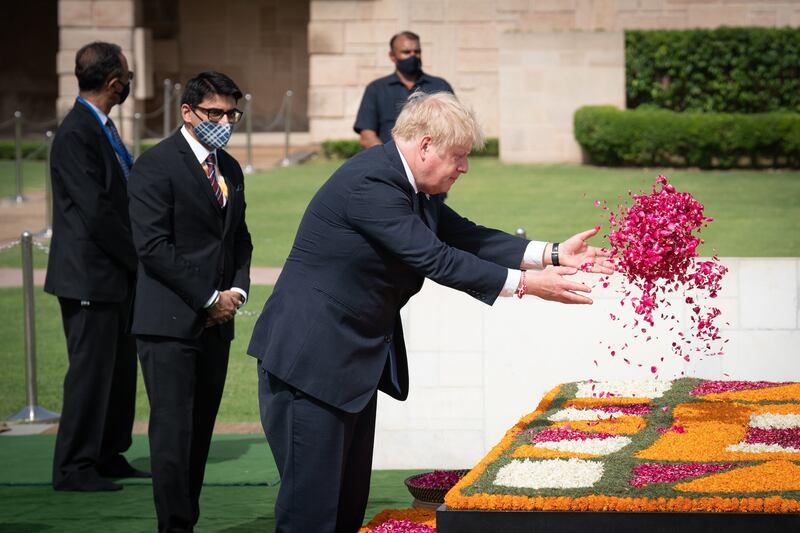 The British prime minister lays a wreath at the memorial in Raj Ghat. Getty Images