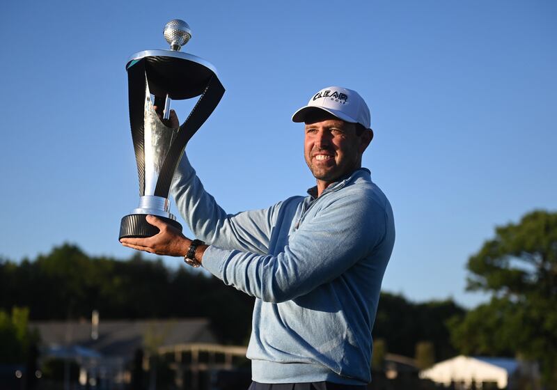 Charl Schwartzel poses with the trophy after winning the LIV Golf Invitational Series at the Centurion Golf Club in St Albans. EPA