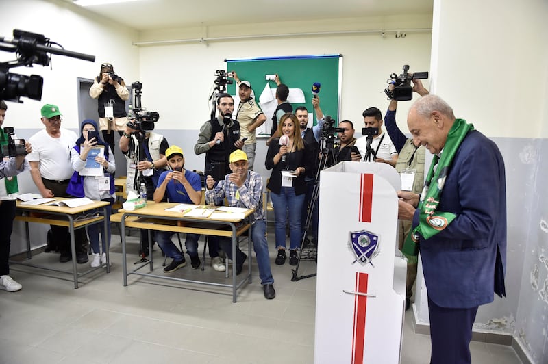 Nabih Berri, Speaker of the Lebanese Parliament, stands in a polling booth to vote in Tebnin. Reuters
