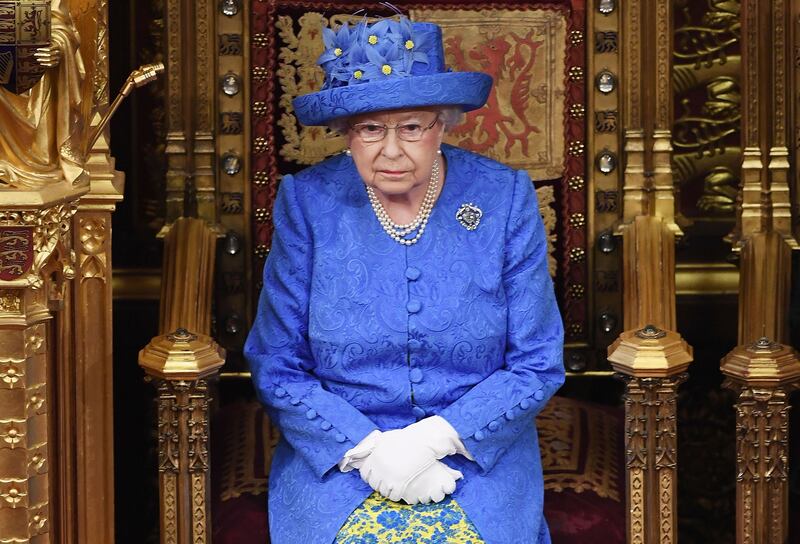 (FILES) In this file photo taken on June 21, 2017 Britain's Queen Elizabeth II attends the State Opening of Parliament in the House of Lords at the Houses of Parliament in London on June 21, 2017.  Queen Elizabeth II has emphasised the need for Britons to come together to "seek out the common ground", in what has been viewed as an appeal to overcome divisions over Brexit. Speaking to members of the Women's Institute (WI) near her Sandringham estate in eastern England, the 92-year-old said people should never lose sight of the bigger picture. / AFP / POOL / Carl Court
