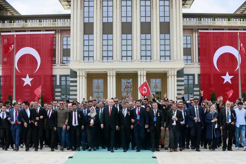 Turkish President Recep Tayyip Erdogan (C) visiting Martyrs Memorial on the third anniversary of the failed coup attempt at the Presidential Palace in Ankara, Turkey.  EPA