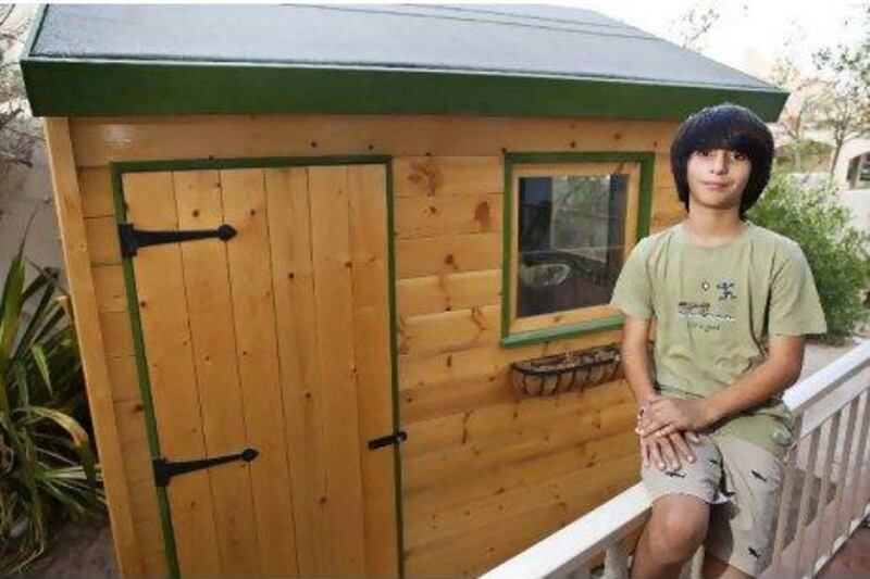Salman Rouhani, 13, with an Out of The Box shed in his parents' garden in Dubai.