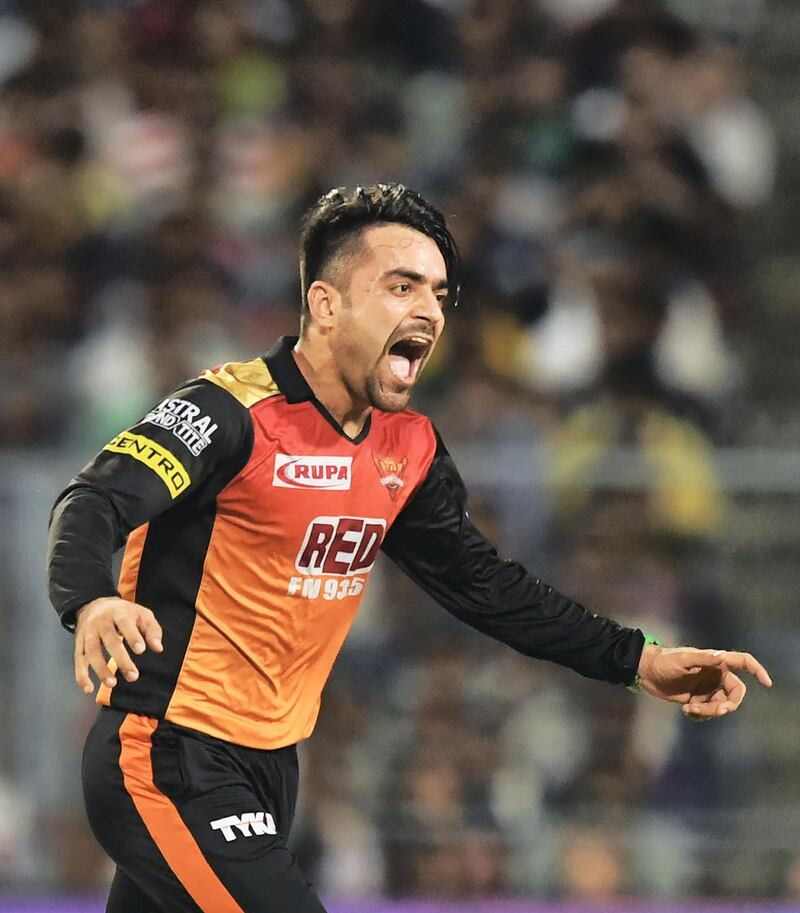 Sunrisers Hyderabad cricketer Rashid Khan celebrates after taking the wicket of Kolkata Knight Riders cricketer Andre Russell during the 2018 Indian Premier League(IPL) Twenty20 second Qualifier cricket match between Kolkata Knight Riders and Sunrisers Hyderabad at The Eden Gardens Cricket Stadium in Kolkata on May 25, 2018.  / AFP PHOTO / Dibyangshu SARKAR / ----IMAGE RESTRICTED TO EDITORIAL USE - STRICTLY NO COMMERCIAL USE----- / GETTYOUT