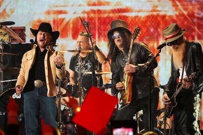 Cody Johnson, Billy Gibbons and Slash perform a tribute for Gary Rossington of the Lynyrd Skynyrd band during the CMT (Country Music Television) Music Awards in Austin, Texas, U. S. , April 2, 2023.  REUTERS / Mario Anzuoni