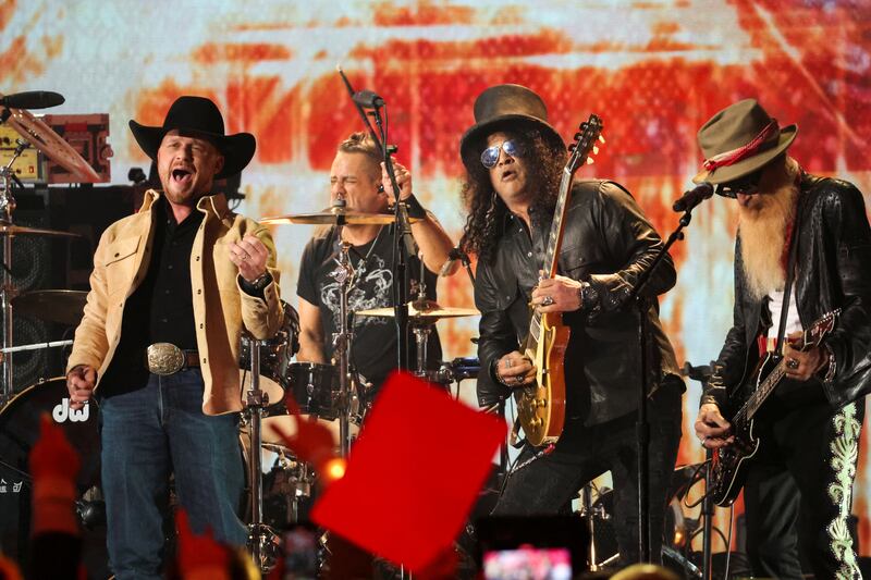 Cody Johnson, Billy Gibbons and Slash perform a tribute for Gary Rossington of the Lynyrd Skynyrd band. Reuters