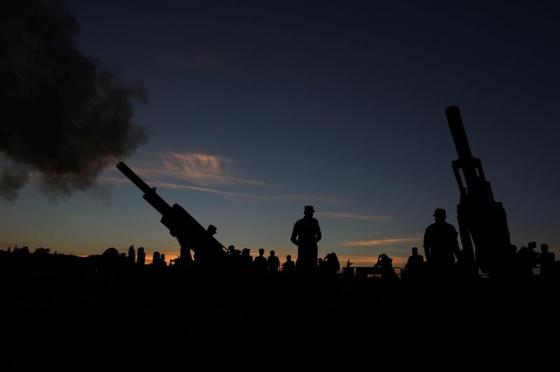 Members of the Jordanian army fire a cannon to announce the breaking of the fast during holy fasting month of Ramadan at Amman Citadel, Jordan.  REUTERS