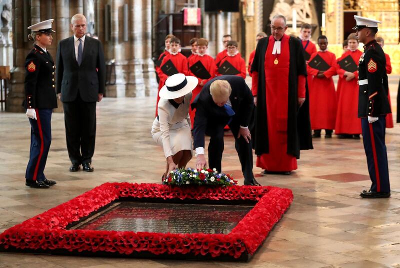 US President Donald Trump and First Lady Melania Trump lay a wreath at the Grave of the Unknown Warrior during their visit to Westminster Abbey in London, England. Getty Images