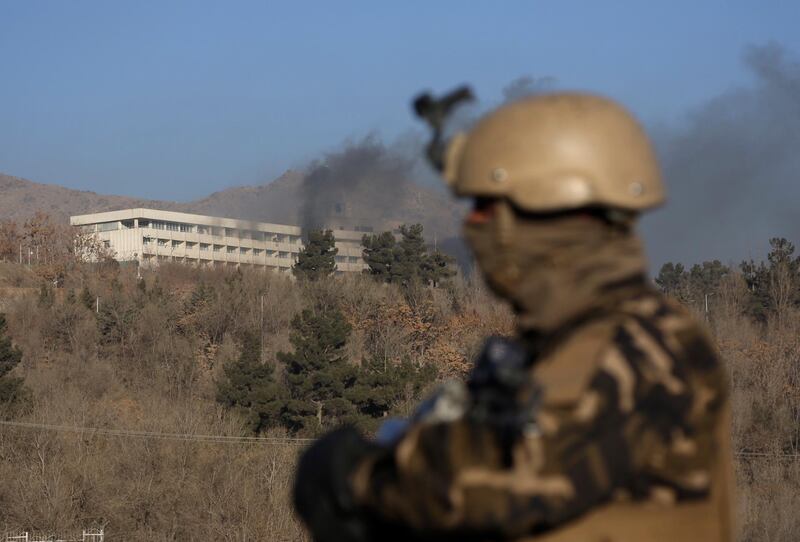 Black smoke rises from the Intercontinental Hotel after an attack in Kabul, Afghanistan. Rahmat Gul / AP Photo