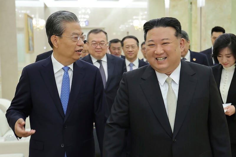 Zhao Leji, left, chairman of the National People's Congress of China, talks to North Korean leader Kim Jong-un during a visit to Pyongyang this month. Photo: Korea News Service via AP