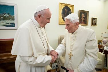 Pope Francis, left, and his predecessor, Pope Emeritus Benedict XVI, have different approaches to running the Catholic Church. Reuters