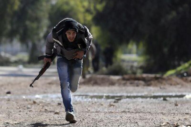 A Free Syrian Army fighter runs for cover in a suburb of Damascus. The rebels may be facing an even greater threat than traditional weapons.