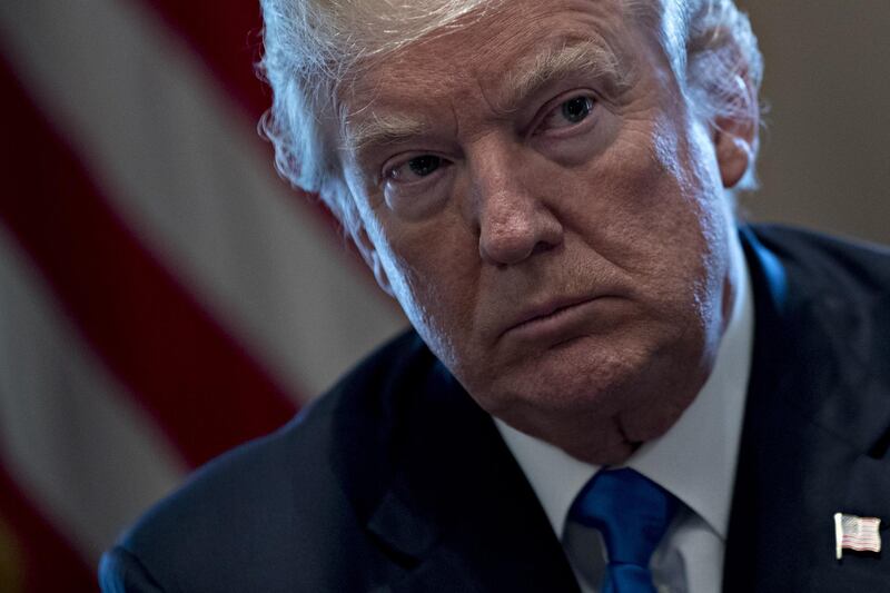 U.S. President Donald Trump listens during a meeting with bipartisan members of Congress on immigration in the Cabinet Room of the White House in Washington, D.C., U.S., on Tuesday, Jan. 9, 2018. Trump indicated he's willing to split contentious immigration proposals into two stages, providing protections for young immigrants known as dreamers and increasing border security first, leaving tougher negotiations on comprehensive legislation for later. Photographer: Andrew Harrer/Bloomberg