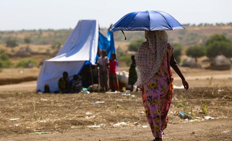 An Ethiopian woman, who fled her home due to ongoing fighting, is pictured at a refugee camp in the Hamdait border area of Sudan's eastern Kassala state. AFP