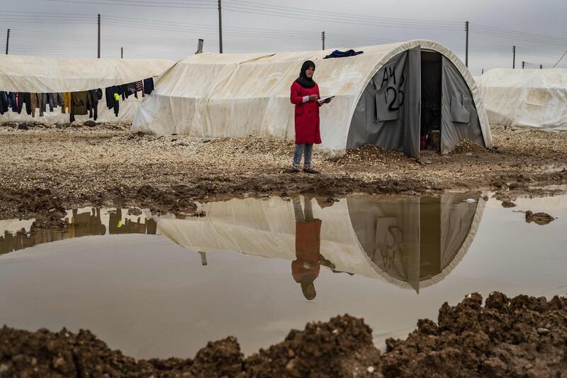 A displaced Syrian woman is pictured in the Washukanni Camp for the internally displaced people near the predominantly Kurdish city of Hasakeh in northeastern Syria.  AFP