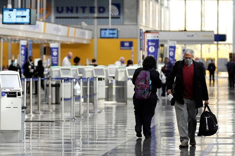 Travellers walk through O'Hare International Airport in Chicago. The CDC has added 16 new destinations to its High Risk for Covid-19 category