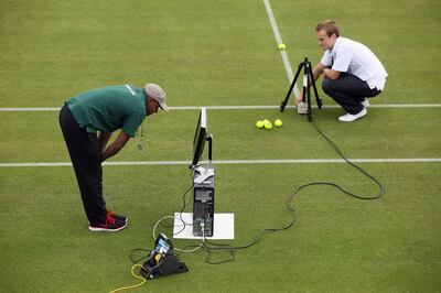 Hawk-Eye technicians check their ball-detection systems at the All England Lawn Tennis and Croquet Club before the Wimbledon Lawn Tennis Championships in 2011. Getty Images