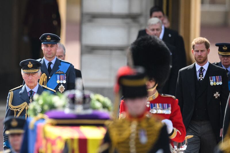King Charles, Prince William and Prince Harry walk behind the coffin of Queen Elizabeth. AFP
