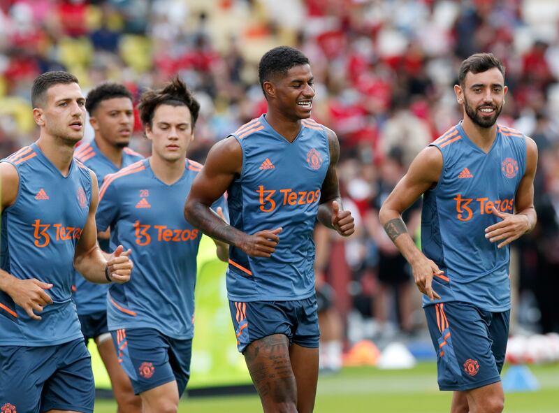 Left to right: Diogo Dalot, Marcus Rashford, and Bruno Fernandes during training. EPA