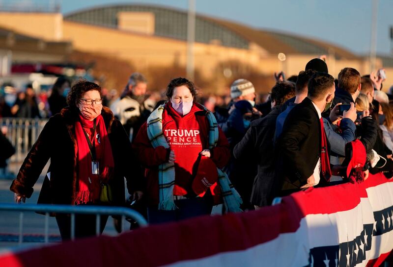 Supporters of US President Donald Trump gather at Joint Base Andrews in Maryland for Trump's arrival. AFP
