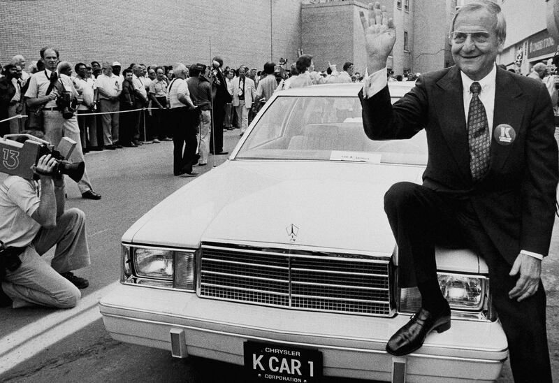 CORRECT CREATION DATE TO AUG. 6, NOT 7 - FILE - In this Aug. 6, 1980, file photo, Chrysler Corp. Chairman Lee Iacocca sits on the hood of K Car Number One, a Plymouth Reliant, in Detroit. Former Chrysler CEO Iacocca, who became a folk hero for rescuing the company in the '80s, has died, former colleagues said Tuesday, July 2, 2019. He was 94. (AP Photo/Dale Atkins, File)
